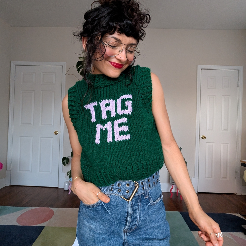 Green Knit Sweater Vest with Pink 'TAG ME' Design - Picture 1 of 5